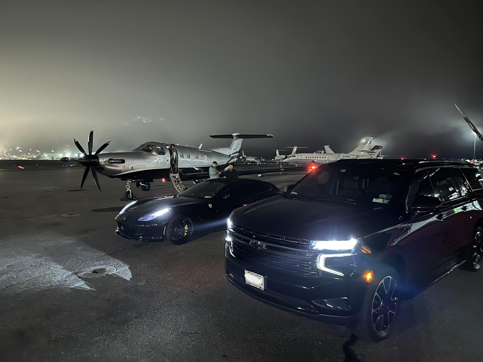 Black Cadillac Escalade luxury chauffeur service at private airport